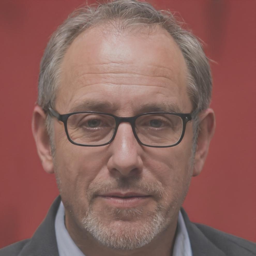 Friendly financial advisor Angus Thornfield smiling professionally in modern office setting
